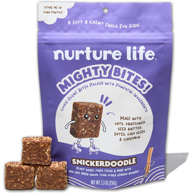 Purple package of 'nurture life Mighty Bites' snack with snickerdoodle flavor, featuring a cartoon cookie character.