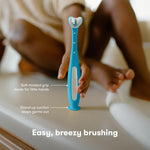 Frida Baby Triple-Angle Toothhugger Training Toddler Toothbrush, Easter Basket Stuffer for Kids, Toddler Toothbrush 2+, Soft Bristles, Suction Cups, Three Sided, Cleans All Sides at Once, Blue