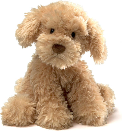 Beige plush dog toy on a white background