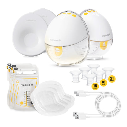 Medela breast pump set with various components on a white background