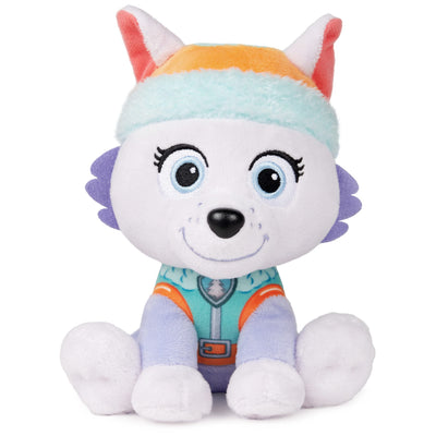 Plush toy dog with a colorful rainbow hat on a white background
