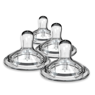 Set of four clear baby bottle nipples on a white background