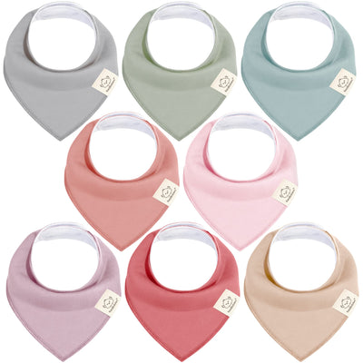 Set of nine baby bibs in various colors on a white background