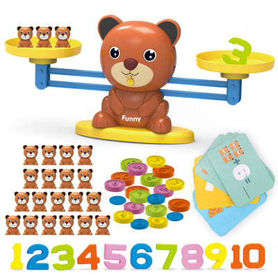 Balancing bear toy with additional items including teddy bear figures, colorful buttons, and number cards on a white background.