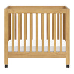 Babyletto Origami Mini Crib with Wheels - GREENGUARD Gold Certified - Portable Baby Crib for Small Spaces - Foldable & Converts to Twin Bed - Easy Setup - 2 Adjustable Mattress Positions - Honey