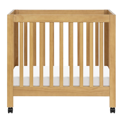 Babyletto Origami Mini Crib with Wheels - GREENGUARD Gold Certified - Portable Baby Crib for Small Spaces - Foldable & Converts to Twin Bed - Easy Setup - 2 Adjustable Mattress Positions - Honey