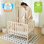 MAMAZING EvoNook 6-in-1 Convertible Mini Crib, 100% New Zealand Wood, Portable Mini Cribs with Wheels for Small Spaces, GREENGUARD Gold Certified, Washed Natural