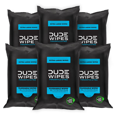 Multiple packages of Dude Wipes on a white background