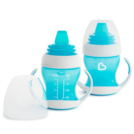 Two blue baby sippy cups with handles on a white background
