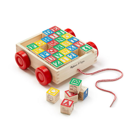 Wooden toy with colorful alphabet blocks and red wheels on a white background