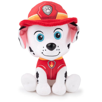 Plush toy dog in a red uniform with a helmet on a white background