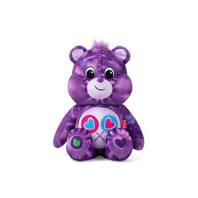Purple teddy bear with a heart design on a white background