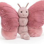 Pink butterfly plush toy on a white background