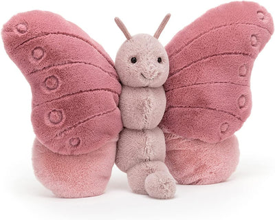 Pink butterfly plush toy on a white background