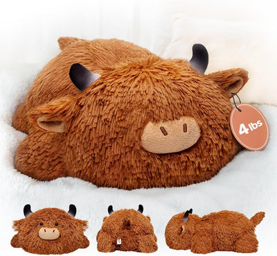 Plush toy Highland cow with a tag indicating weight on a white background