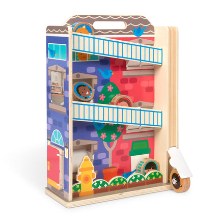 Wooden toy building set with colorful packaging on a white background