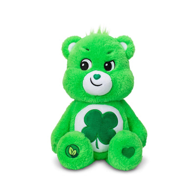 Green teddy bear with a shamrock on a white background