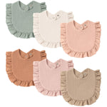 Set of six baby bibs in various colors on a white background