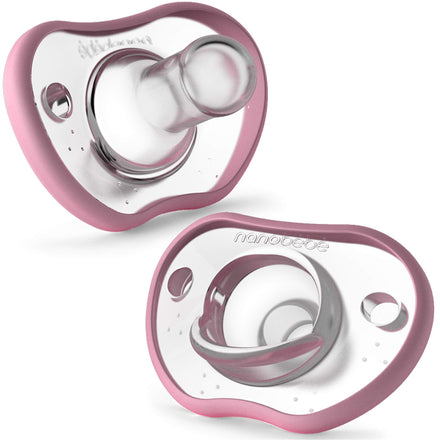 Two pink and clear baby pacifiers on a white background