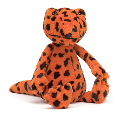 Plush toy with orange and black leopard print on a white background