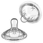Clear baby bottle nipple on a white background
