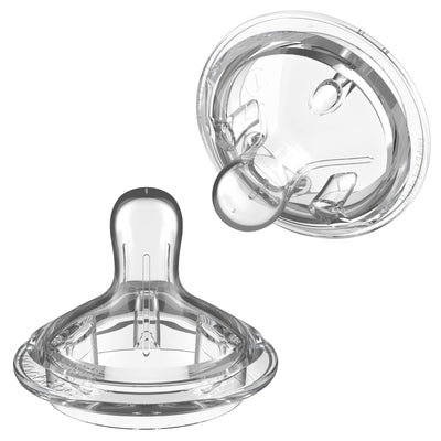 Clear baby bottle nipple on a white background