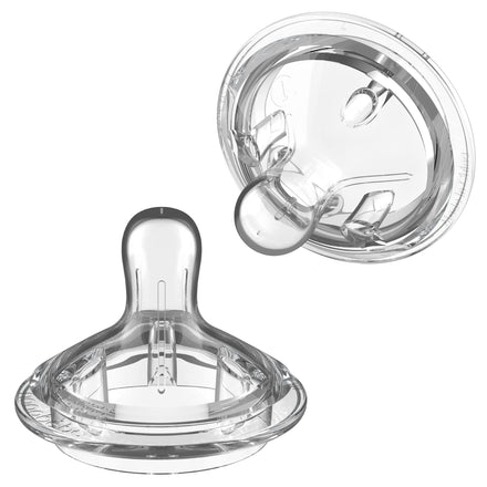 Clear baby bottle nipple on a white background