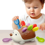 Child playing with a colorful hedgehog toy