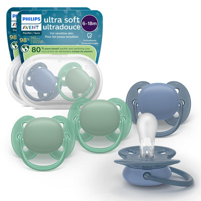 Philips Avent ultra soft pacifiers in green and blue with packaging on a white background