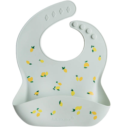 Light blue baby bib with lemon pattern on a white background
