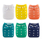 Set of six colorful cloth diapers with button closures on a white background