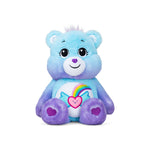 Blue and purple teddy bear with a rainbow and heart design on a white background