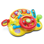 Colorful toy car dashboard with steering wheel and buttons on a white background