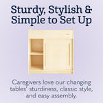 Foundations SafeGlide Daycare Changing Table, Durable Wood Construction, Built-in Shelving for Ample Storage, Gliding Doors, Adjustable Safety Strap, Includes Foam Mattress Pad (Natural)