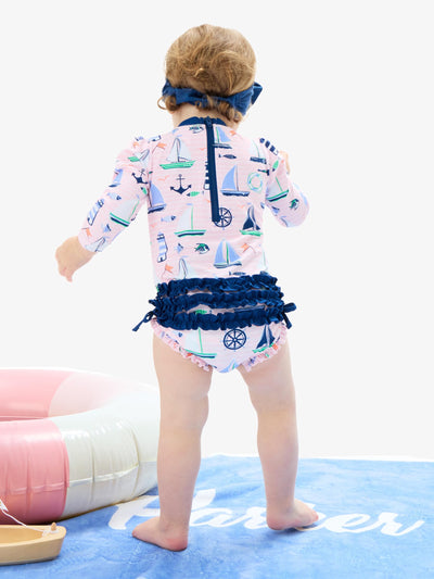 RuffleButts Baby Girls UPF 50+ Sun Protection Novelty Print Long Sleeve One Piece Rash Guard Swimsuit with Zipper - Pink Sweet Sails, 3-6m