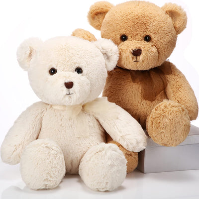 Two teddy bears, one white and one brown, sitting next to each other on a white background.