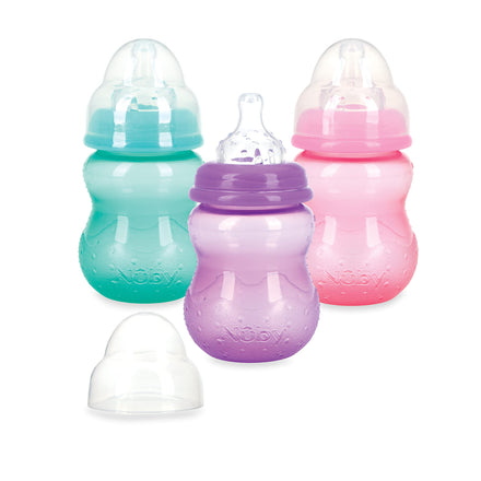 Three baby bottles in green, purple, and pink on a white background