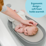 The First Years Sure Comfort Renewed Baby Bather - 50% Recycled Material Baby Bath Seat - Baby Bath Support for Infants - Newborn Bath Essentials Ages 0 to 5 Months
