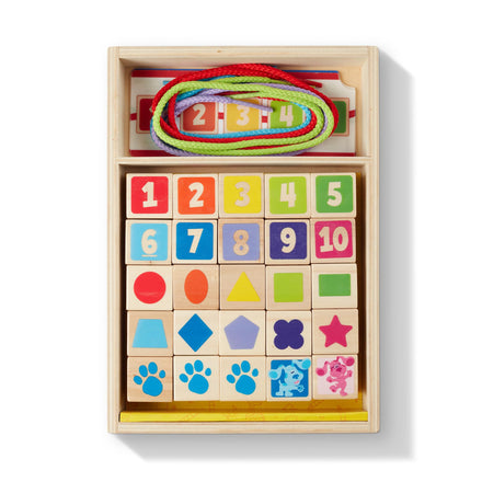 Wooden toy set with colorful blocks, numbers, and shapes in a box.