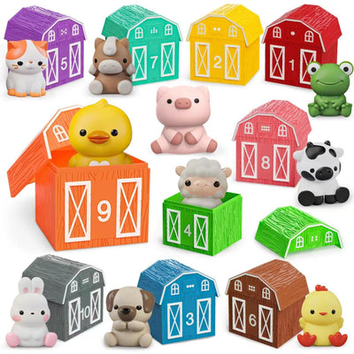 Set of colorful toy barns and farm animals on a white background