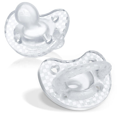 Two clear baby pacifiers on a white background