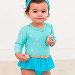 RuffleButts Baby Girls UPF50+ Princess Long Sleeve Bow Skirted One Piece Swimsuit - Teal Golden Princess, 6-12m