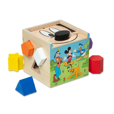 Wooden shape sorting cube with cartoon characters on a white background