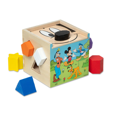 Wooden shape sorting cube with cartoon characters on a white background