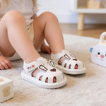 Kutterild Baby Boys Girls Summer Sandals Cute Bear Pattern Squeaky Shoes Non-Slip Newborn First Walking Shoes (Ivory, 6-9 Months)