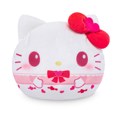 Plush toy shaped like a cat face with a red bow on a white background