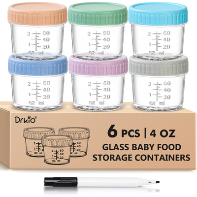 Set of six glass baby food storage containers with colored lids on a cardboard box.