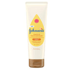 Johnson's Creamy Oil tube with yellow label on a white background