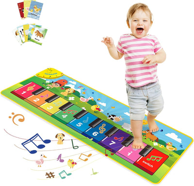 Child playing on a colorful piano mat with cartoon animals and musical notes