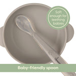 Baby-friendly spoon with soft handle for teething babies, on a white background.